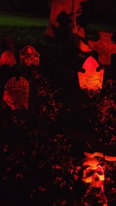 Mock cemetery displays (complete with fake tombstones and skeletons) contradict the "peaceful" invocation to "rest in peace" (RIP). Many mourners despise them. (Photo by Teresa TL Bruce)